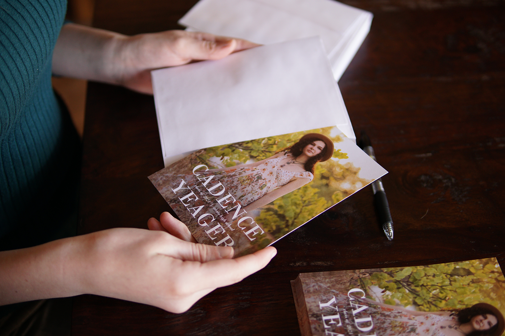 Women holding graduation card