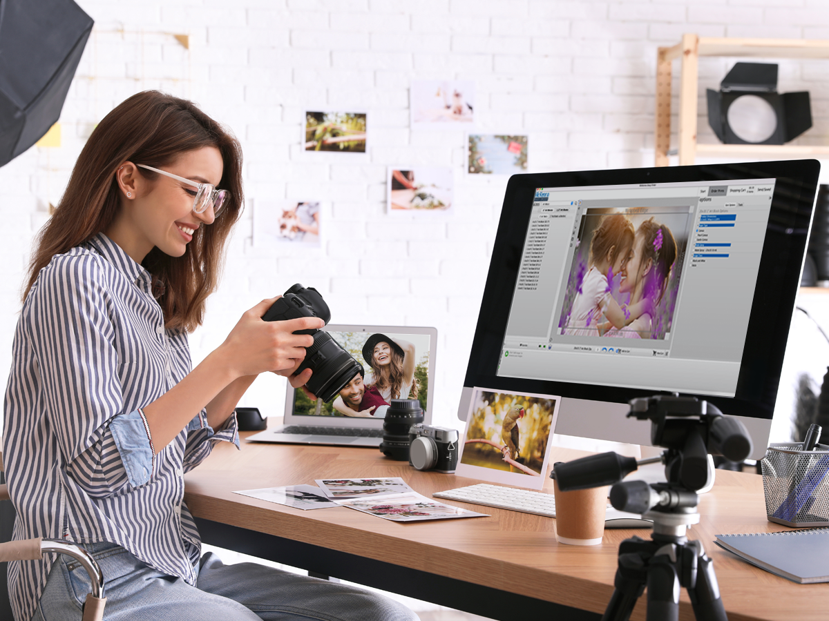 Photographer at a computer with the McKenna Easy Order software open.