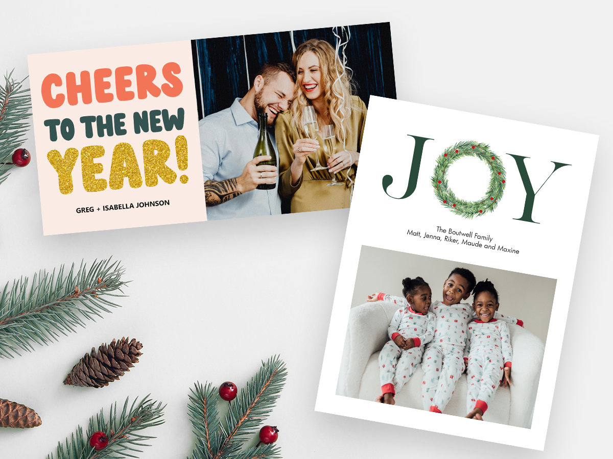 "Cheers to the New Year!" and "JOY" holiday card designs at McKenna.